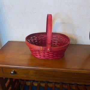 Maroon color woven basket with functioning handle